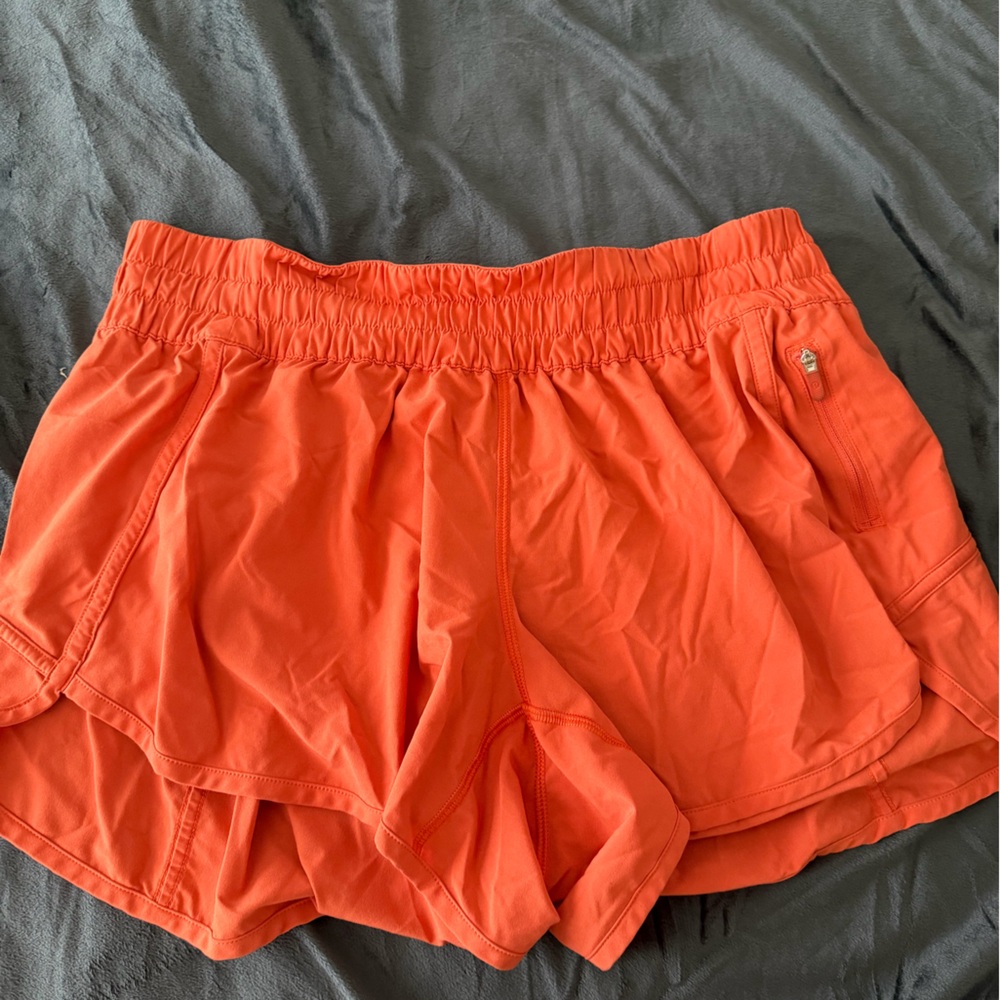 Women’s lululemon 4” track short Vibrant Orange